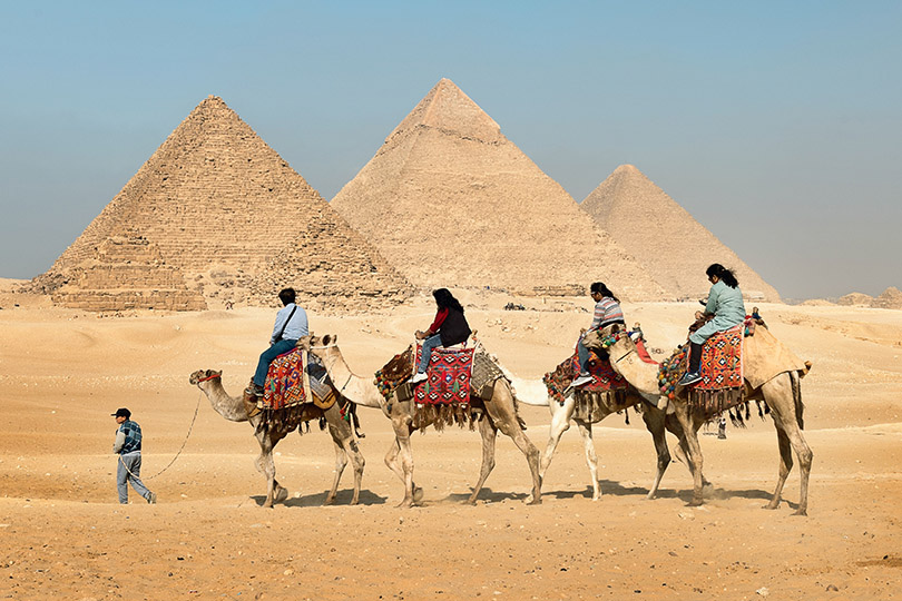 Riding camels to Giza pyramid complex